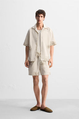 BERMUDA SHORTS WITH FLORAL EMBROIDERY