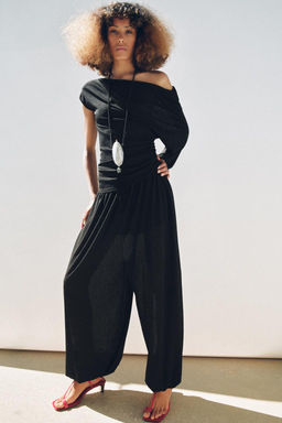 FLOWING ASYMMETRIC TOP