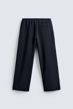 FLOWING TROUSERS WITH ZIPS