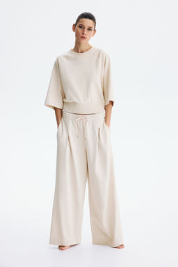 Pantal?n con cord?n de ajuste y pliegue decorativo - H&m фото 5