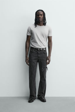 JEANS FLARE FIT ROTOS / Negro