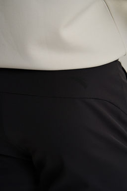 Брюки текстильные Черный TRN Woven Track Pants - Anta фото 6