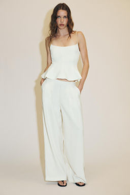 STRETCH PEPLUM TOP