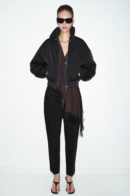 PLEATED TROUSERS WITH TURN-UP HEM