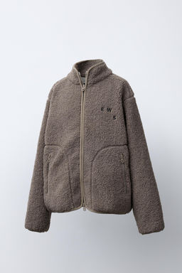 FAUX SHEARLING JACKET WITH EMBROIDERED TEXT