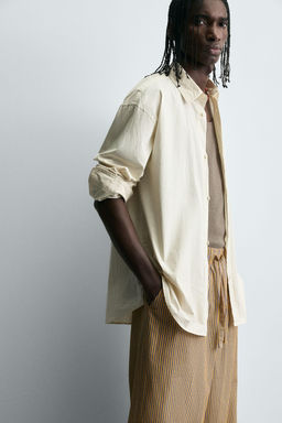 STRIPED OVERSIZE FIT TROUSERS