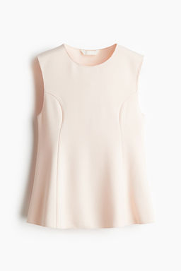 Top interlock con peplum