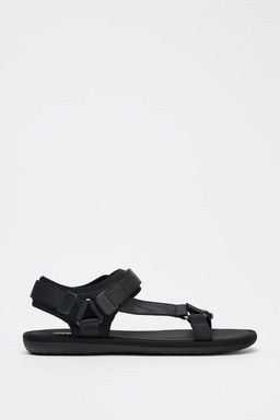 SANDALS WITH ADHESIVE STRAPS