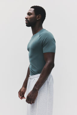 Camiseta de deporte con DryMove Muscle Fit - H&m фото 11