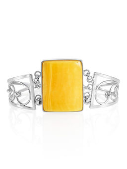 Стильный ажурный браслет, украшенный медовым янтарём