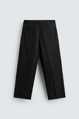PANTAL?N FLUIDO RELAXED FIT PLIEGUES / Negro