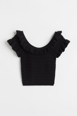 Top cropped con volantes