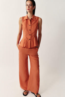CHALECO RAYAS PEPLUM / Caldero
