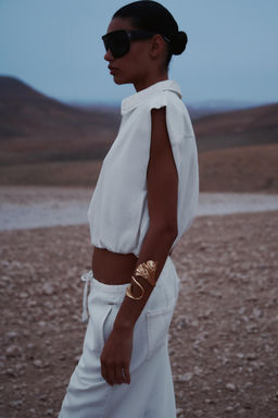 TOPSTITCHED WAISTCOAT WITH ELASTICATED HEM