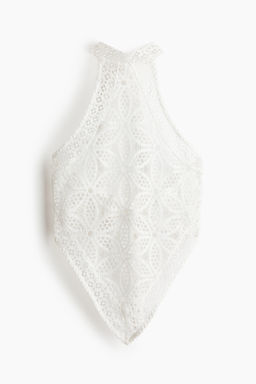 Top asim?trico de encaje con escote halter