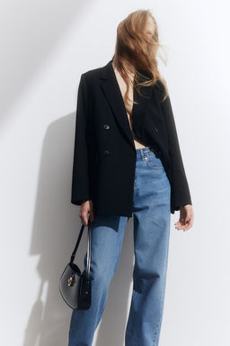 Vaquero pitillo con cadena decorativa