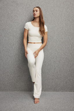 Leggings de yoga acampanados en SoftMove - H&m фото 3