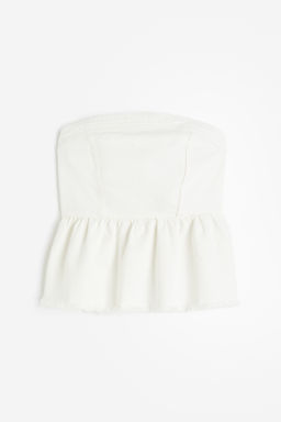 Top bustier en denim con peplum