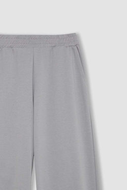 Базовые однотонные широкие серые спортивные штаны с широкими карманами на штанинах - Defacto фото 2