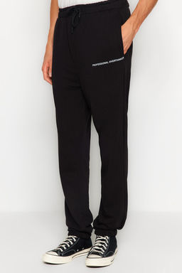 TRENDYOL MAN Siyah Oversize/Genis Kesim Minimal Yaz?l? Jogger Esofman Alt? TMNAW24EA00000
