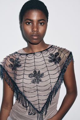 CAPE WITH BEADED EMBROIDERY