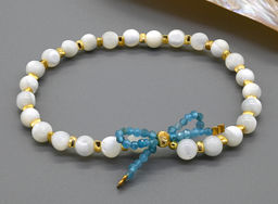 Браслет с шариками из перламутра бантик из апатита, 17см