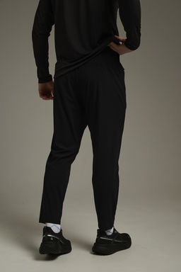 Брюки трикотажные укороченные Черный ADVANCED RUNNING Knit Ankle Pants - Anta фото 3