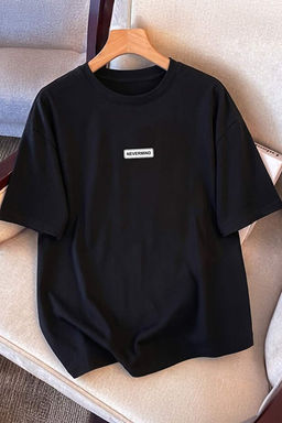 Siyah Oversize/Geni_ Kesim Slogan Bask_l_ _rme %100 Pamuk T-Shirt TMNSS26TS00086