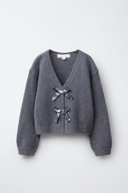 V-NECK KNIT CARDIGAN WITH SHIMMERING BOWS