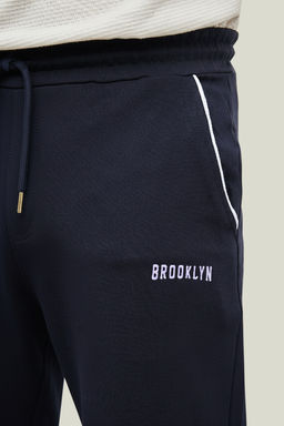 Lacivert Regular Fit Bask?l? Biyeli Lastik Paca Esofman Alt? TMNSS22EA0121