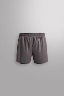 PANTALONES CORTOS RUNNING 2 EN 1 / Morado