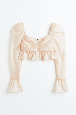 Blusa cropped con manga puffy y peplo