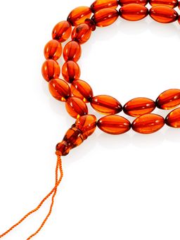 Чётки мусульманские на 33 бусины-оливки из цельного янтаря коньячного цвета