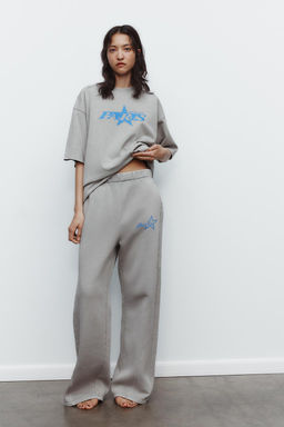 WASHED EFFECT PLUSH TROUSERS WITH TEXT