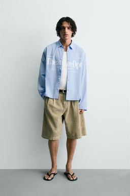 CAMISA RELAXED FIT CUADROS TEXTO / Azul claro