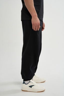 Брюки трикотажные Черный ANTA SPORTS CLUB Knit Track Pants фото 5