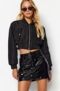 TRENDYOLMILLA Siyah Parlak Suni Deri Mini Dokuma Etek TWOAW24ET00176