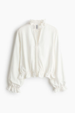 Blusa con ribetes de volante