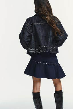 ASYMMETRIC RUFFLED SKIRT WITH STUDS