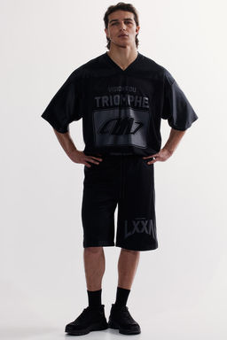 Pantalon de deporte a la rodilla en malla DryMove