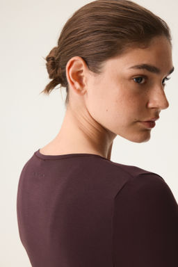 Top de deporte cruzado en modal - H&m фото 17