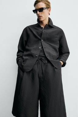 BERMUDA FLUIDA JACQUARD RAYAS / Negro - Zara фото 6