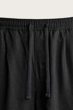 PANTAL?N RELAXED FIT 100% LYOCELL / Negro - Zara фото 9