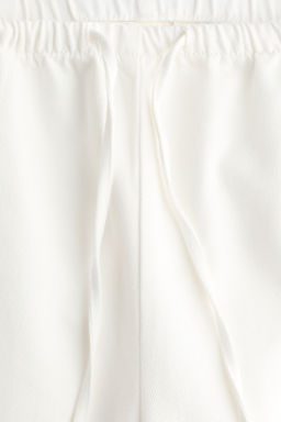 Pantal?n denim con cord?n de ajuste - H&m фото 10