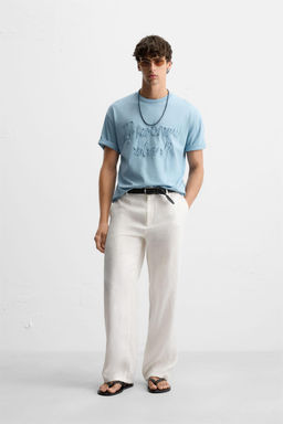 T-SHIRT WITH RAISED SLOGAN