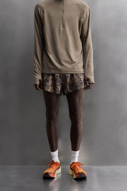 RUNNING SHORTS WITH TREE PRINT