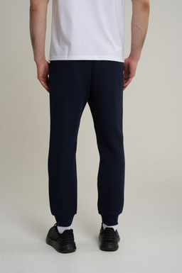 Брюки трикотажные Темно-синий TRN ESSENTIAL Knit Track Pants - Anta фото 7