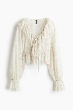 Blusa de malla con volantes