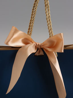 Пакет подарочный ламинированный, тёмно синий с золотым, с бантом, 19×15×7 см